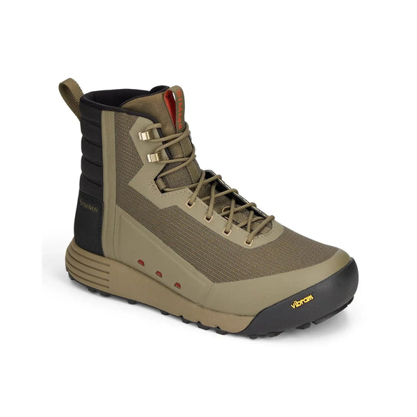 Three-quarter view of Simms men's Access wading boot in olive tan showing Vibram toe cap and lug outsole with white background