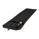 Angled view of Orvis Recon 3WT 9' fly rod with four-piece olive blank and cork handle, partially in black rod sock
