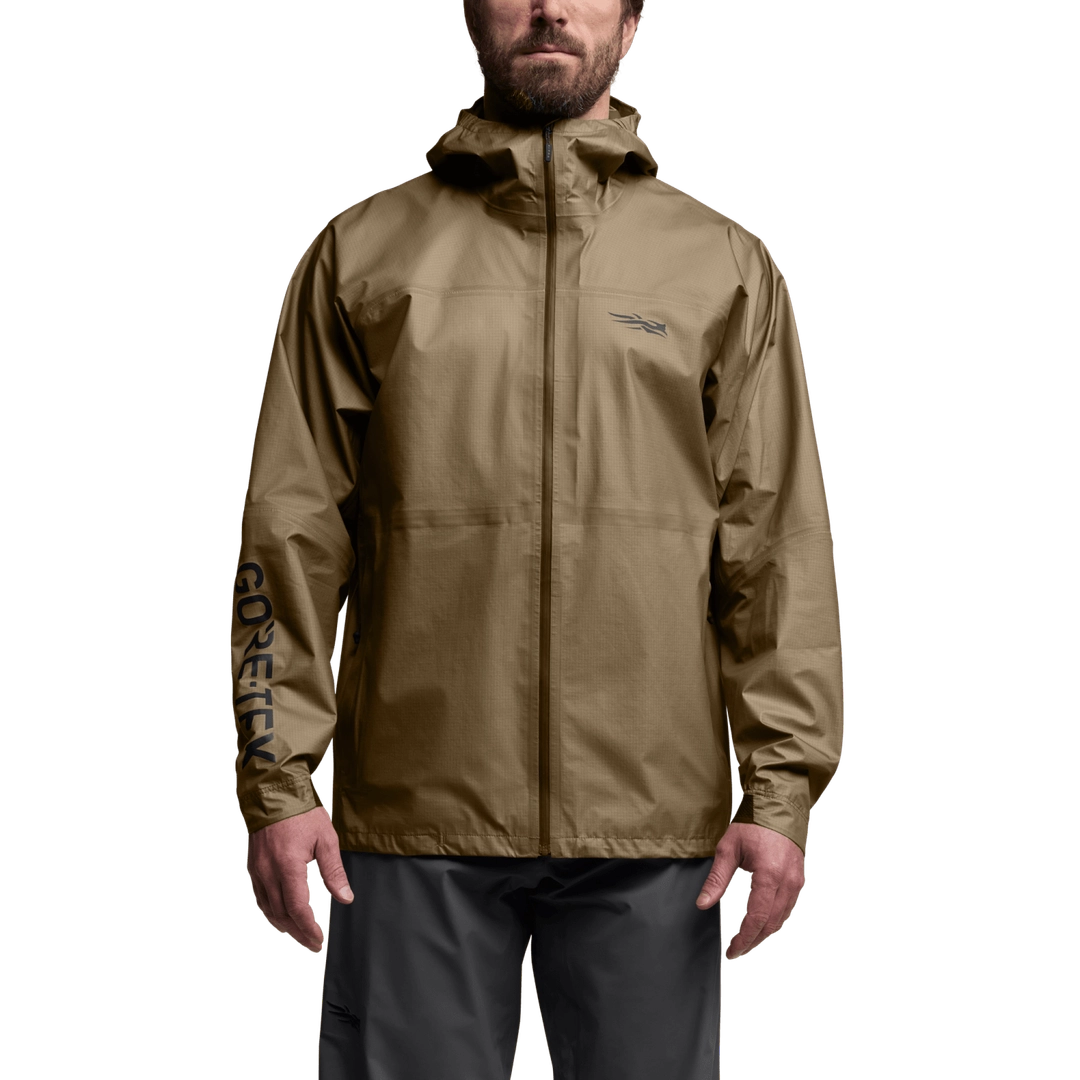 Front view of SITKA Dew Point UL Jacket in brown on model with hood, full zipper, and GORE-TEX logo on sleeve