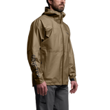Three-quarter view of SITKA Dew Point UL jacket in brown with hood, waterproof zip and GORE-TEX logo on sleeve on model