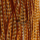 Close-up of Whiting Farms Rooster 1/2 Saddle Bronze Grade showcasing long, supple barred dark ginger feathers with dense barbs, tightly cropped background