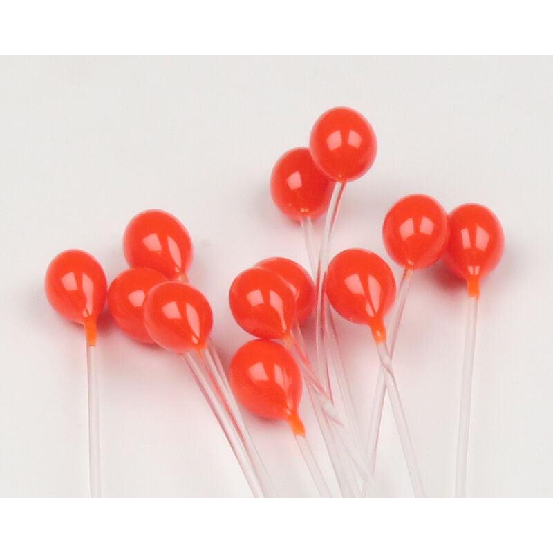 Close-up of Epoxy Mono Crab Eyes, fluorescent orange epoxy heads on clear monofilament stems on white background