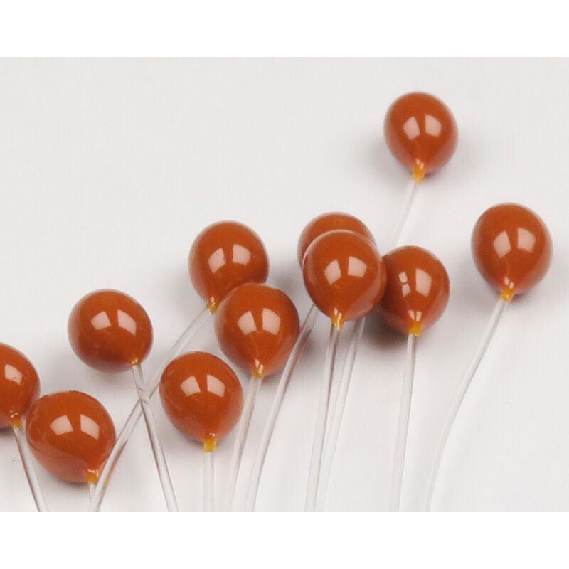 Close up of Epoxy Mono Crab Eyes showcasing brown epoxy-coated eye bulbs on clear monofilament stems against white background