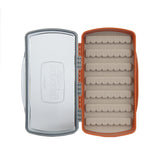Top-down view of Fishpond Tacky Pescador medium fly box showcasing clear lid and burnt-orange case with beige dynamic foam rows on white background