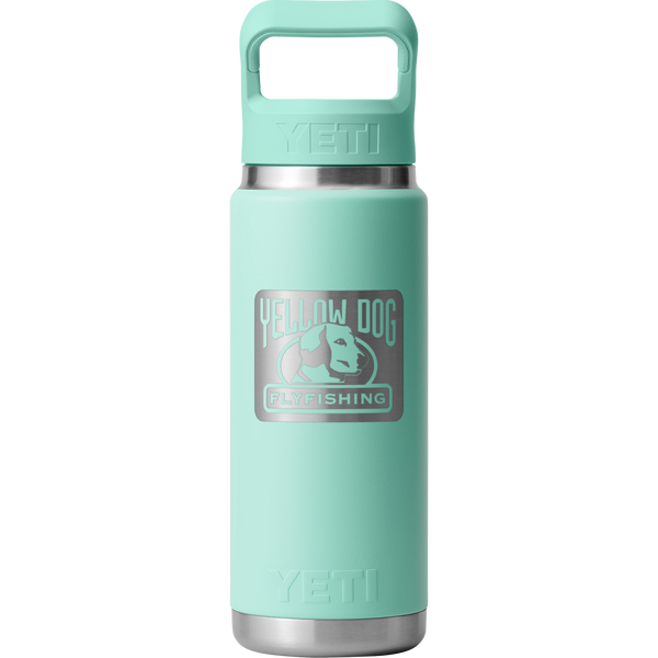 Front view of YETI Rambler 26 oz Water Bottle with Straw Cap showcasing Big Wave Blue finish and Yellow Dog Flyfishing logo